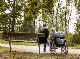 Normal_disabled-woman-in-wheelchair-with-assistant-in-par-2023-11-27-04-49-19-utc