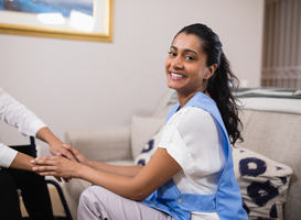 Normal_portrait-of-smiling-doctor-touching-patient-hands-2023-11-27-05-10-32-utc